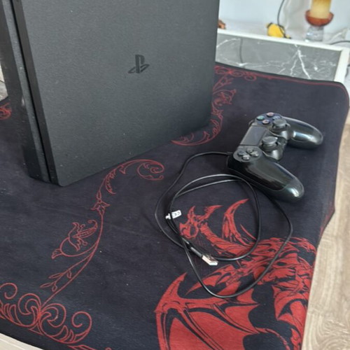 PlayStation 4 Slim console used, 1TB, 1 controller with charging cable
