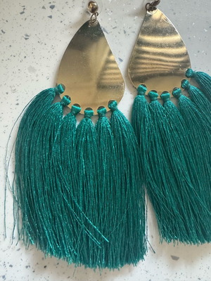 Dangling earrings used, gold-colored