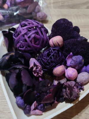 Decorative potpourri like new with dried flowers in purple shades