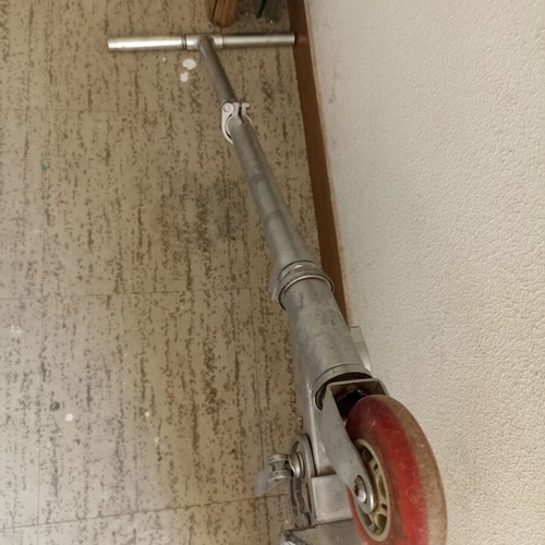 Silver metal scooter used, lightweight and foldable