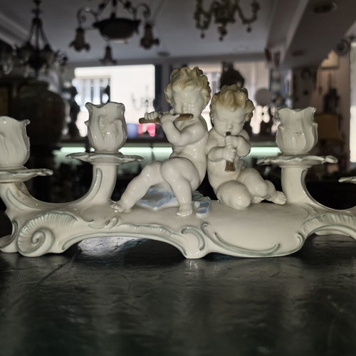 Hutschenreuther Selb porcelain four-light candelabra used, putti design