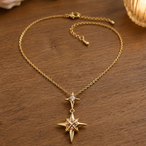 North Star gold necklace with star and pink crystals