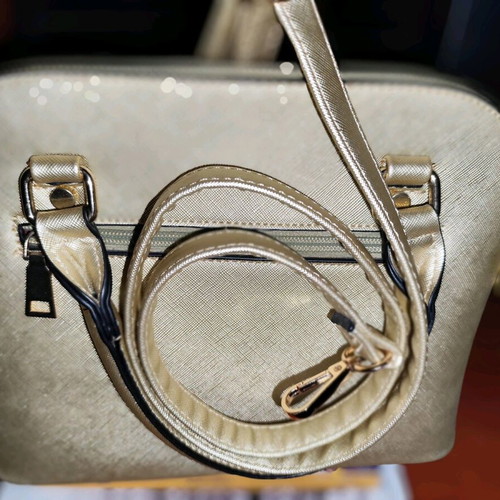Gold handbag like new with detachable strap
