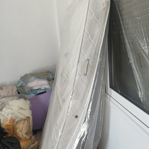Single mattress used, white color, quilted with handles