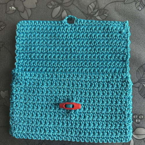 Handmade knitted clutch bag blue with button closure