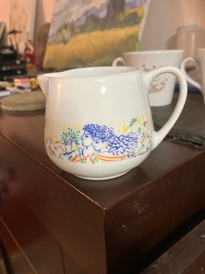 Collectible milk jug with Stathopoulos artwork like new