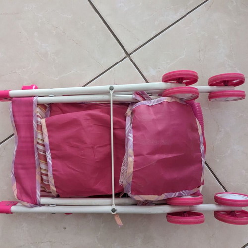 Doll stroller used with wear and fabric tears