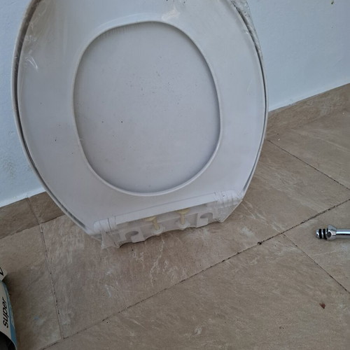 Toilet seat new, wrapped in cellophane