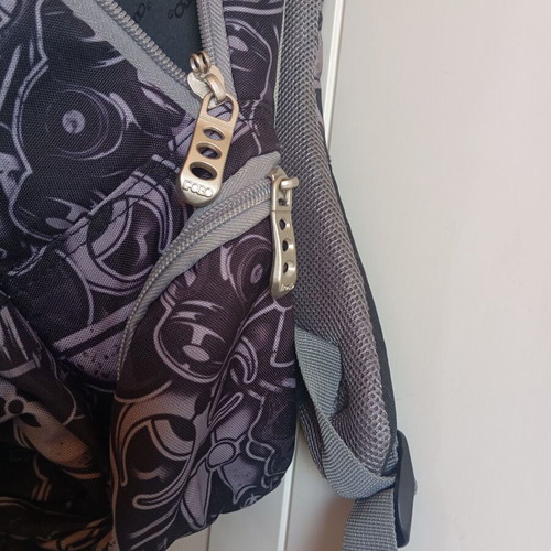 Polo character school backpack with multiple compartments