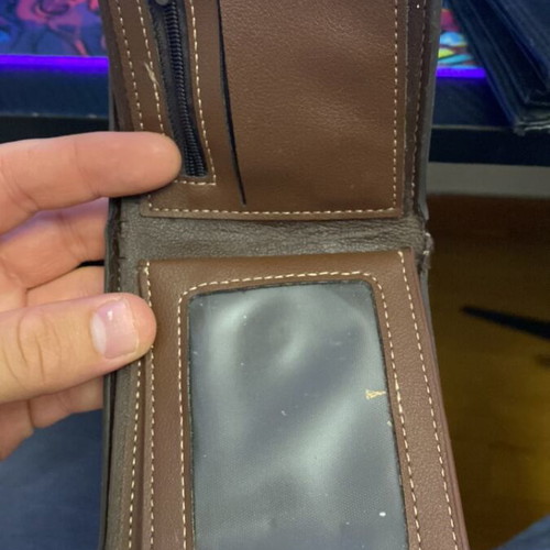 Wallet used, brown with fabric tear at cash compartment