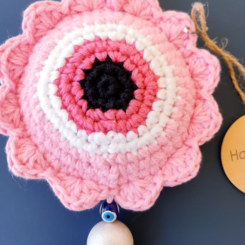 Handmade crochet evil eye in baby pink