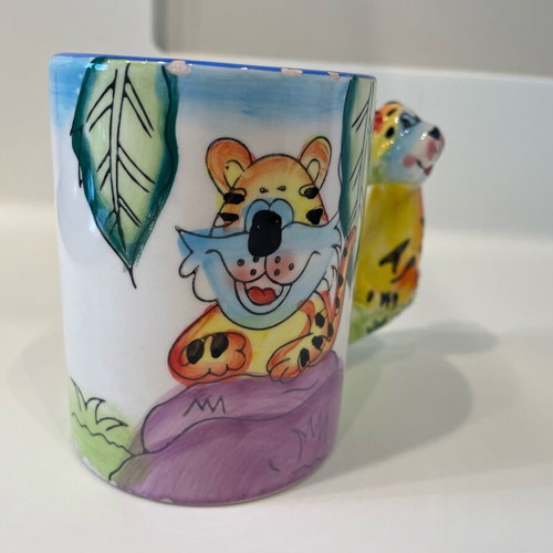 Tiger design mug used, small rim damages