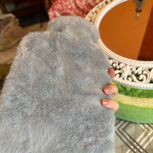 Hot water bottle with furry cover like new, cozy and warm