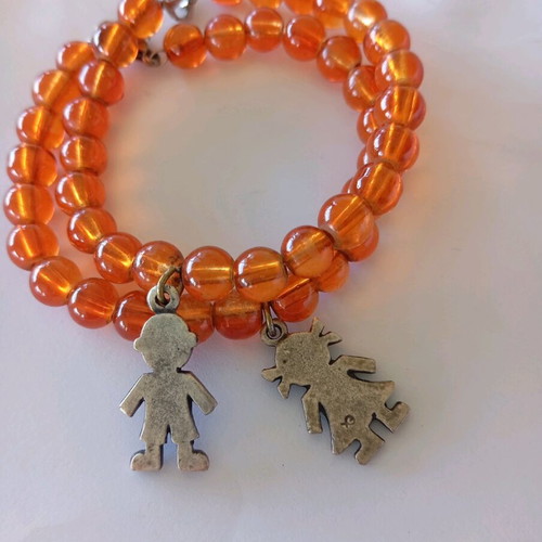 Orange bracelets set of 2 with boy and girl charms