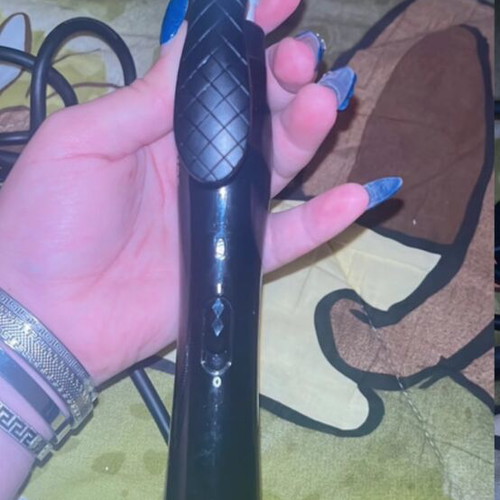 Hair curling iron used with some rust, functional