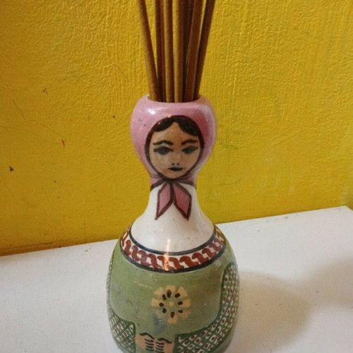 Ceramic vase used with folk costume for aromatic sticks
