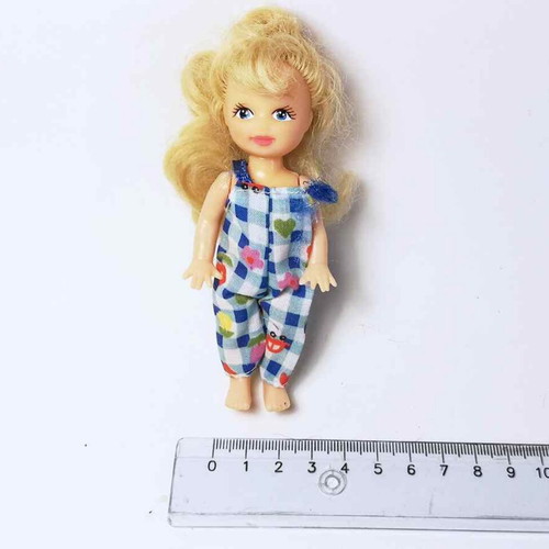 Plastic doll used with torn clothes