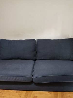 Two-seater fabric sofa used, dark gray color with visible marks