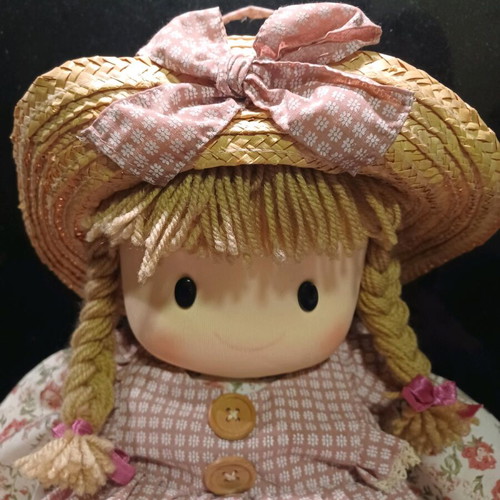 Doll like new with cotton clothes and straw hat