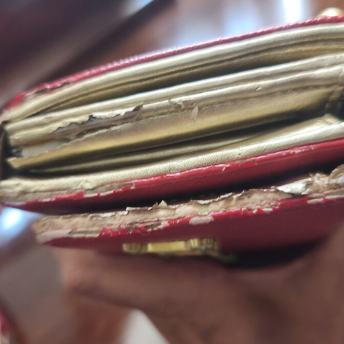 Juicy Couture red wallet used with side wear on gold details
