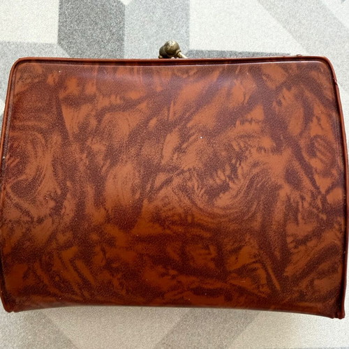 Vintage brown leather wallet used with frame closure
