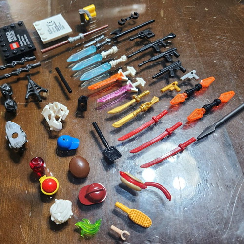 Lego accessory pack used with swords, weapons, hats and armor
