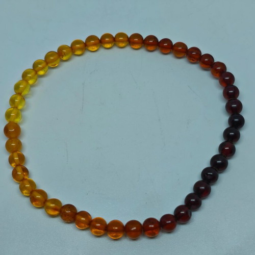 Handmade bracelet from natural amber with color gradient like new