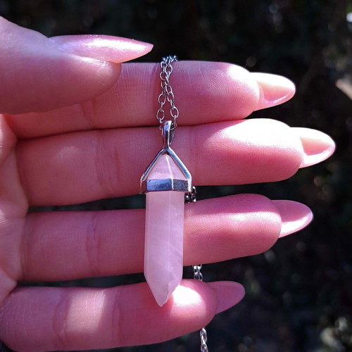 Rose quartz crystal pendant used with silver chain