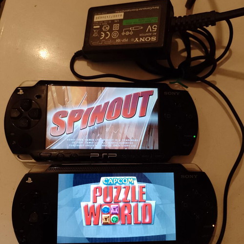 PlayStation Portable (PSP) used, 2 devices with original charger