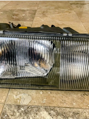 W126 right headlight new, genuine Bosch