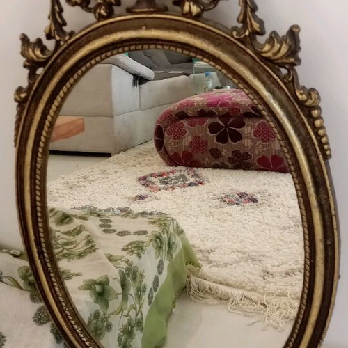 Oval bronze mirror used, antique style with gold paint
