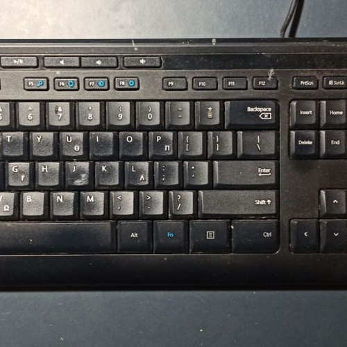 Microsoft computer keyboard used with one missing rear support