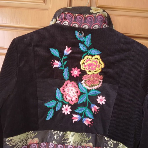 Black corduroy/velvet coat like new, size L/XL with colorful designs