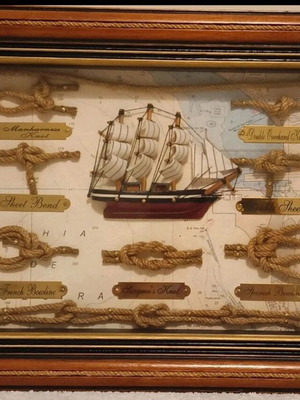 Decorative frame with nautical knots and ship, new