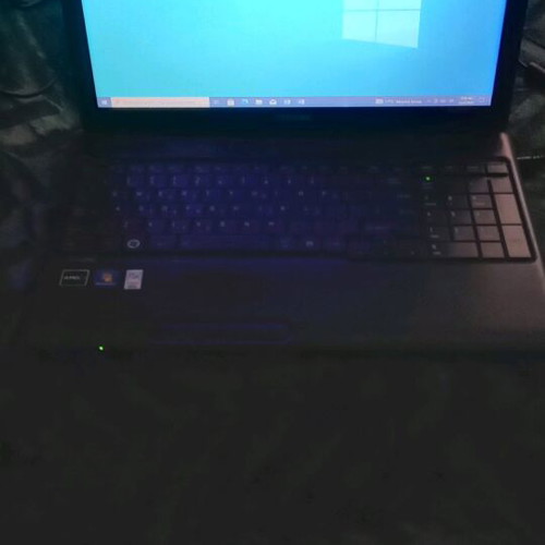 Toshiba Satellite C660D-10D laptop used with charger and accessories