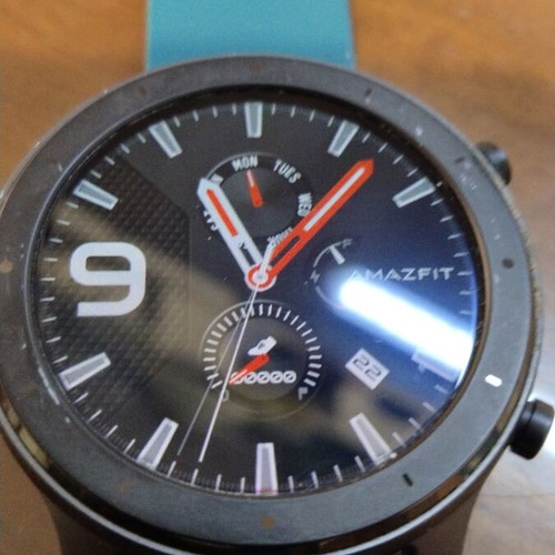 Amazfit GTR smartwatch with removable 22mm strap and charging cable