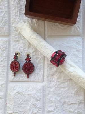 Earrings and ring like new with red Czech crystals