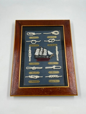 Nautical decorative framed artwork used with knots and sailing ship