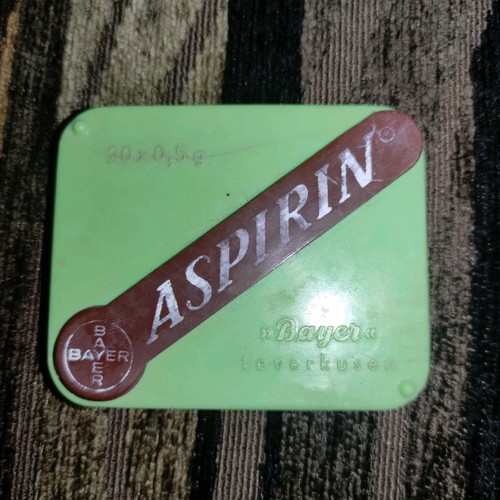 Old aspirin box used with front crack