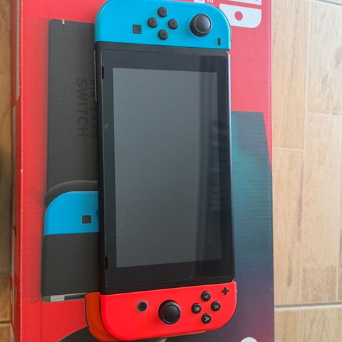 Nintendo Switch console bundle with 4 games and accessories