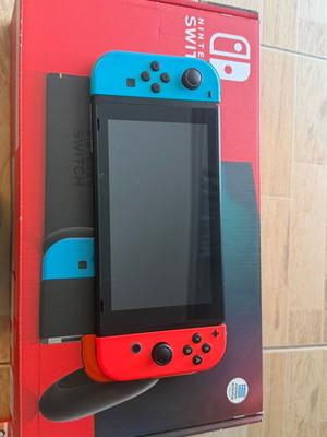 Nintendo Switch console bundle with 4 games and accessories
