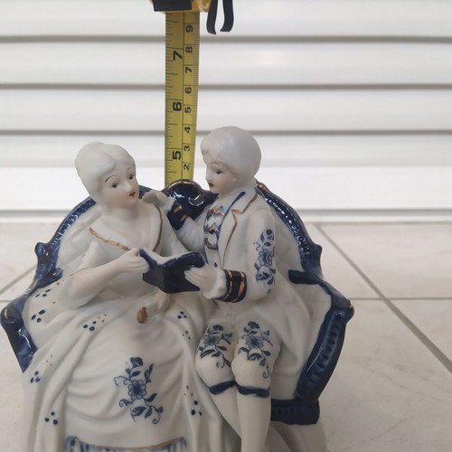 Vintage couple figurine reading on sofa rococo style like new