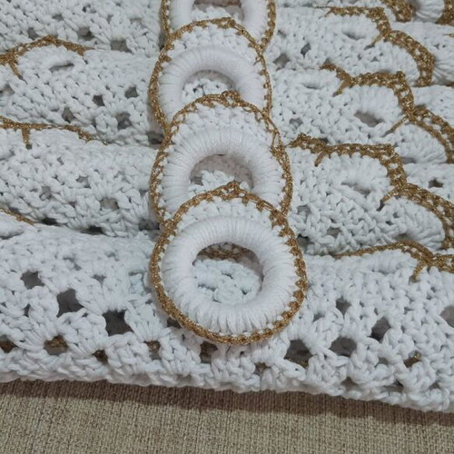 Elegant handmade white table set with gold details and napkin rings