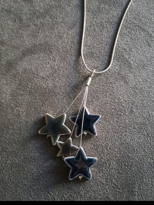 Necklace with chain like new with star design in blue-gray color