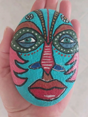 Painted stone new with African mask and acrylics