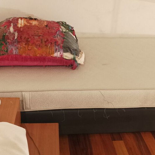 Single mattress used 1.10x2.00 with black fabric upholstered base