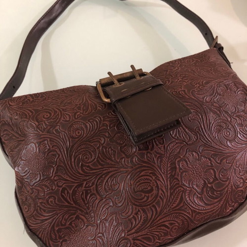 Women's brown shoulder bag used with embossed design