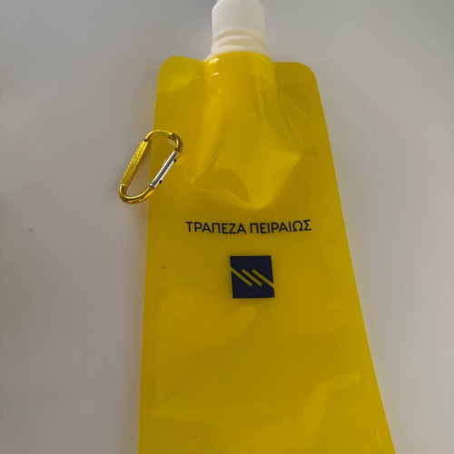 Water or electrolyte pouch new by Piraeus Bank plastic flask with belt ring