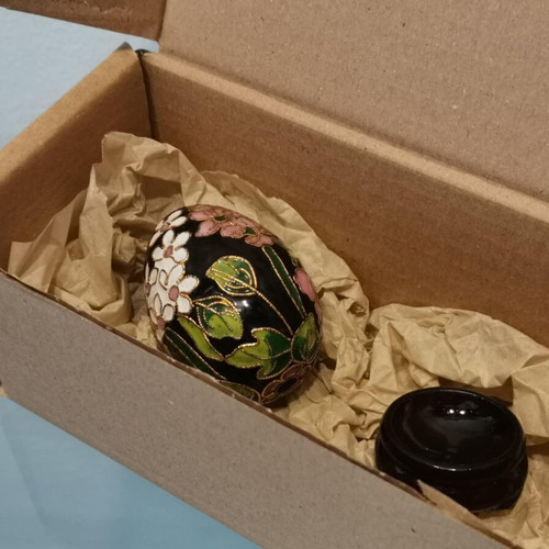 Cloisonne egg used with white and pink cherry blossoms on wooden base
