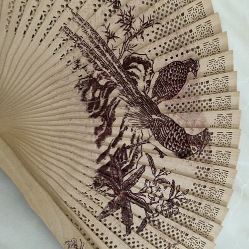 Vintage wooden hand fan used with bird designs